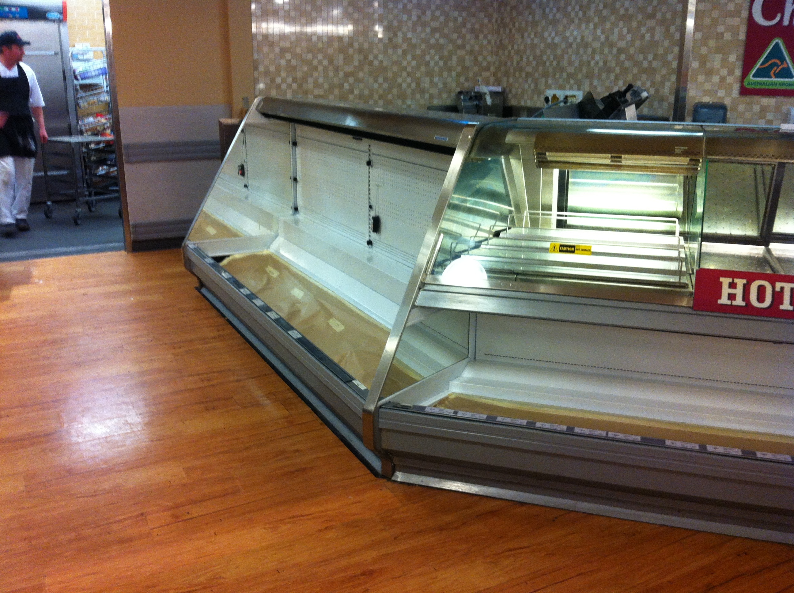 Progress photo of Deli case with electrostatic spray and fabrication works completed onsite